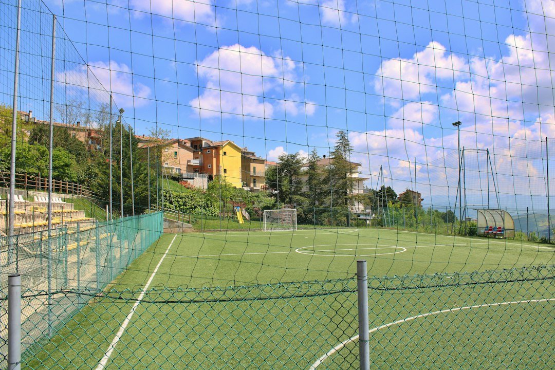 the five-a-side football pitch bordered by a high net